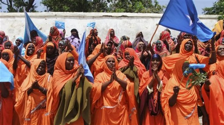 Thousands of Somalis rally in the Somali capital Mogadishu Tuesday, Aug. 23, 2011 at the Konis stadium as part of government organized demonstrations in support of the withdrawal of al- Shabab from Mogadishu. Decades of violence in Somalia has left population vulnerable to the vagaries of weather changes. Islamist insurgents are also attempting to overthrow Somalia's weak U.N.-backed government. The most dangerous among the groups is the al-Qaida-linked al-Shabab militant group, which has barred aid agencies from operating in the territories it controls in southern Somalia.  (AP Photo/Farah Abdi Warsameh)